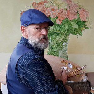 Ben-Hekert-zittend-voor-zijn-ezel-met-schilderij-rozen